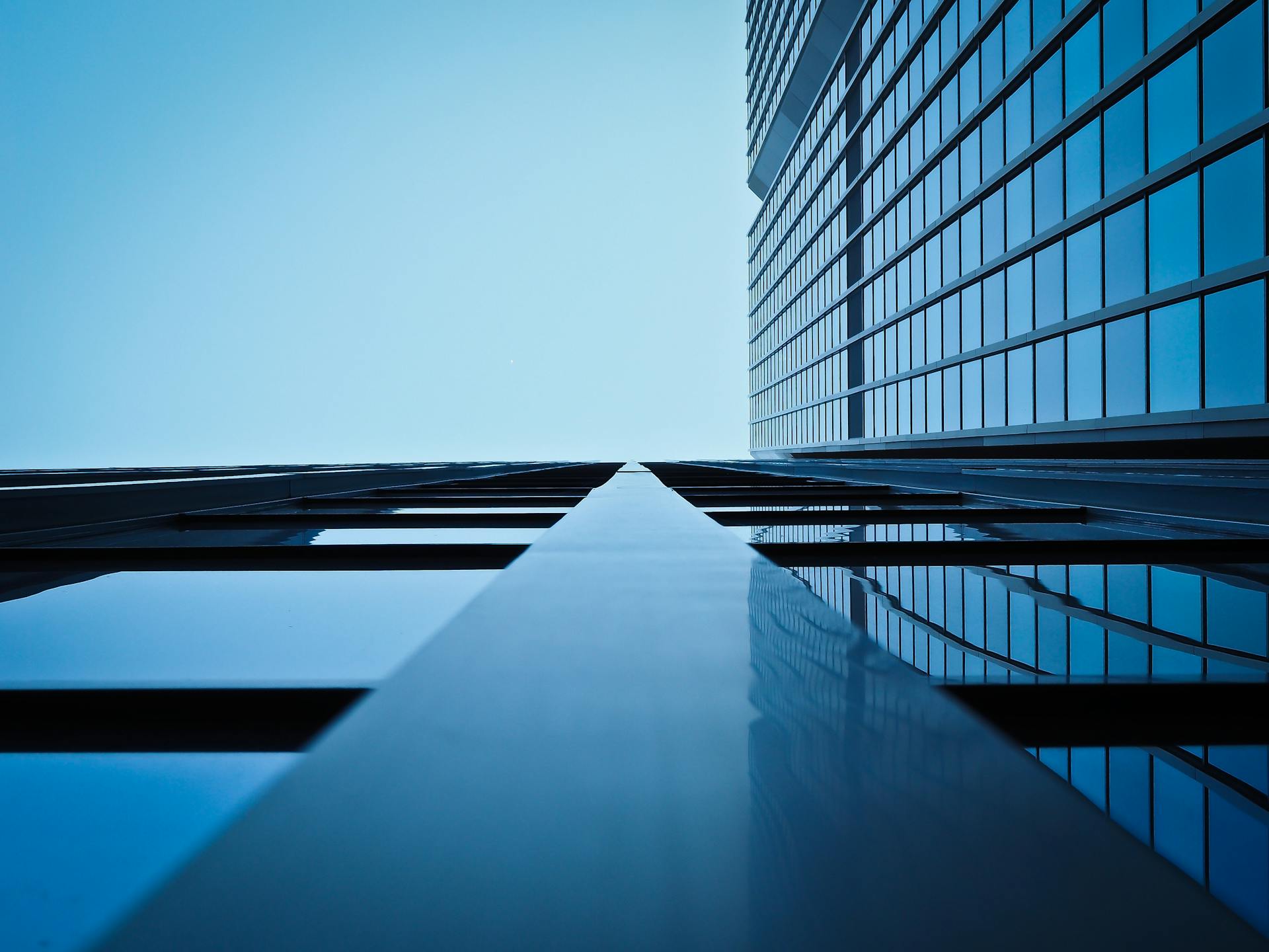 Modern corporate skyscraper against blue sky